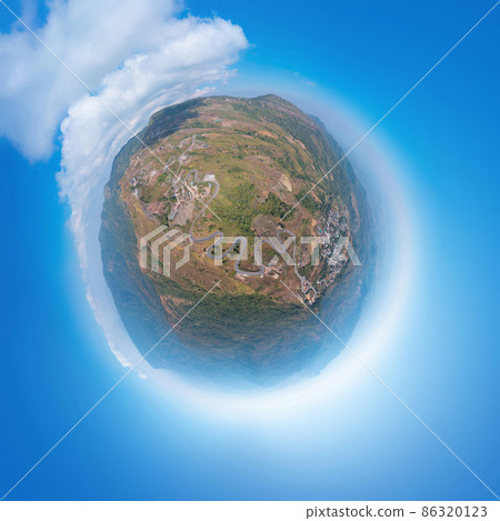 Little planet 360 degree sphere. Panorama of aerial view of cars driving on curved, zigzag curve road or street on mountain hill in rural area of Nan, Thailand. Transportation. Little planet 360 degree sphere. Panorama of aerial view of cars driving on curved, zigzag curve road or street on mountain hill in rural area of Nan, Thailand. Transportation. 86320123