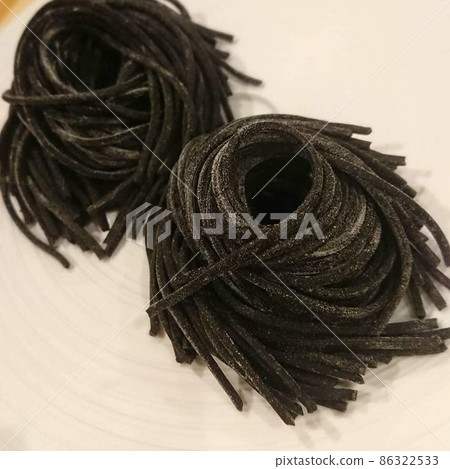 Homemade pasta kneaded with squid ink Homemade pasta kneaded with squid ink 86322533