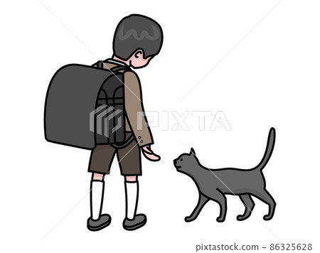 A boy just enrolled with a big school bag playing with a cat 86325628