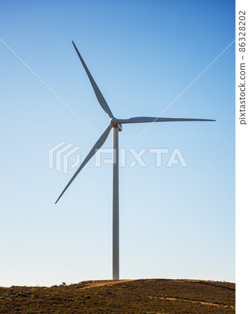 Turbines in a mountain wind farm. Ecological energy production. 86328202
