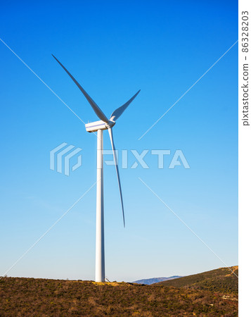 Turbines in a mountain wind farm. Ecological energy production. 86328203