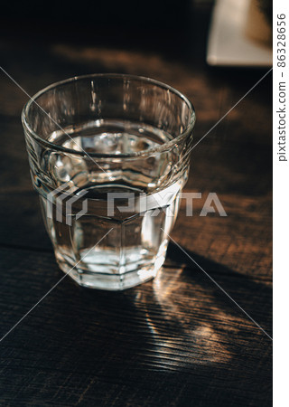 Light shining into the glass 86328656