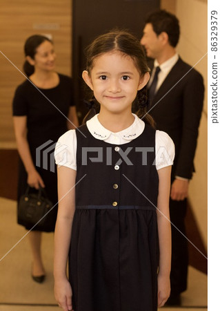 Parents and children heading for an examination interview 86329379