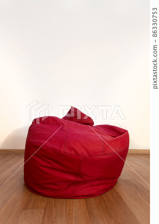 empty red chair bag in living room with wooden floor 86330753