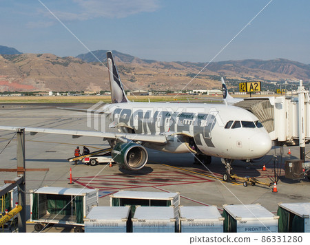 Frontier aircraft A-320 waiting at Salt Lake City Airport Frontier aircraft A-320 waiting at Salt Lake City Airport 86331280
