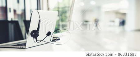 Headset and customer support equipment at call center ready for actively service 86331685