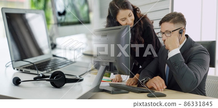 Business people wearing headset working in office broaden view Business people wearing headset working in office broaden view 86331845