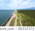 Coastline with a windmill 86332372
