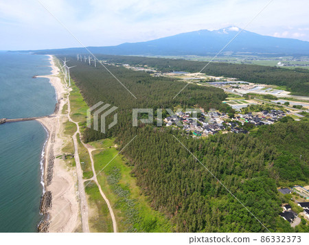 Coastline with a windmill 86332373