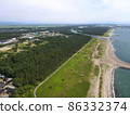 Coastline with a windmill 86332374