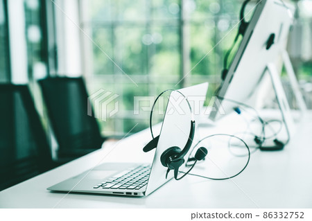 Headset and customer support equipment at call center ready for actively service Headset and customer support equipment at call center ready for actively service 86332752