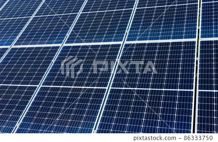 solar panels installed on the ground produce environmentally friendly energy in summer solar panels installed on the ground produce environmentally friendly energy in summer 86333750