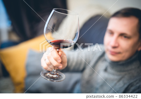 man drinking wine and relaxing 86334422