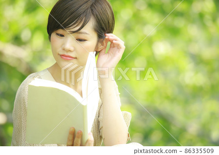 A woman reading A woman reading 86335509