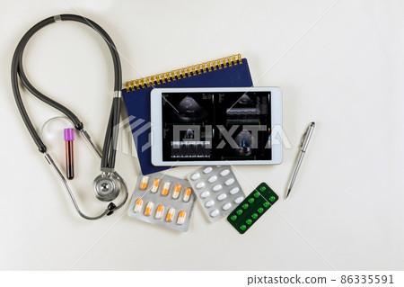 Medical doctor desk with SCI FI heads up heart report analysis the patient display voice print in digital tablet 86335591