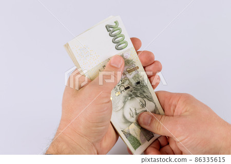 Detail of man hands counting czech money 86335615