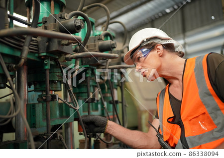 Industry engineer worker operate control heavy machine in factory. Industry engineer worker operate control heavy machine in factory. 86338094