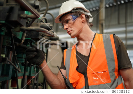 Industry engineer worker operate control heavy machine in factory. Industry engineer worker operate control heavy machine in factory. 86338112