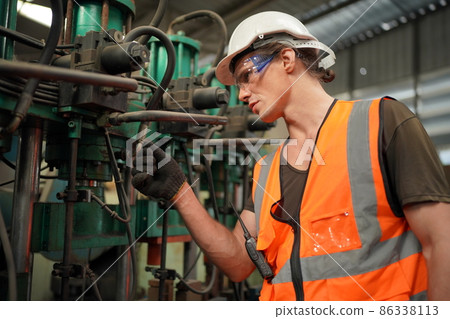 Industry engineer worker operate control heavy machine in factory. Industry engineer worker operate control heavy machine in factory. 86338113