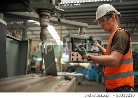 Industry engineer worker operate control heavy machine in factory. 86338230