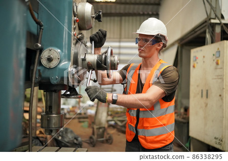 Industry engineer worker operate control heavy machine in factory. Industry engineer worker operate control heavy machine in factory. 86338295
