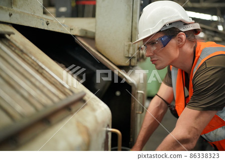 Industry engineer worker operate control heavy machine in factory. Industry engineer worker operate control heavy machine in factory. 86338323