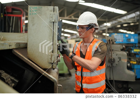 Industry engineer worker operate control heavy machine in factory. Industry engineer worker operate control heavy machine in factory. 86338332