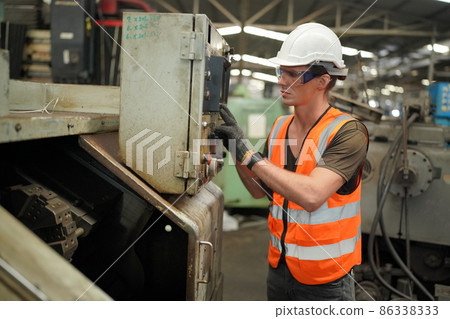 Industry engineer worker operate control heavy machine in factory. Industry engineer worker operate control heavy machine in factory. 86338333