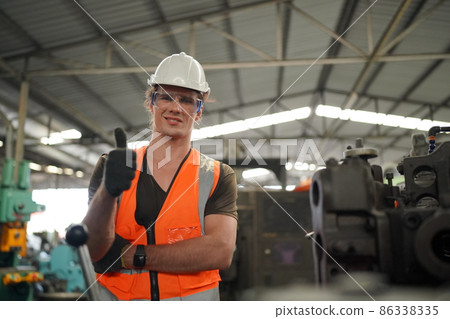 Industry engineer worker operate control heavy machine in factory. 86338335