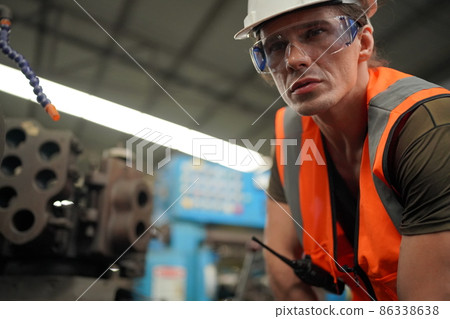 Industry engineer worker operate control heavy machine in factory. Industry engineer worker operate control heavy machine in factory. 86338638