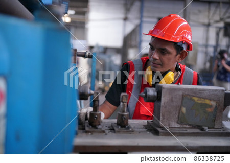 Industry engineer worker operate control heavy machine in factory. 86338725