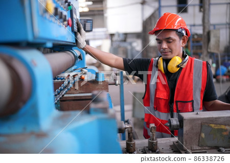 Industry engineer worker operate control heavy machine in factory. Industry engineer worker operate control heavy machine in factory. 86338726