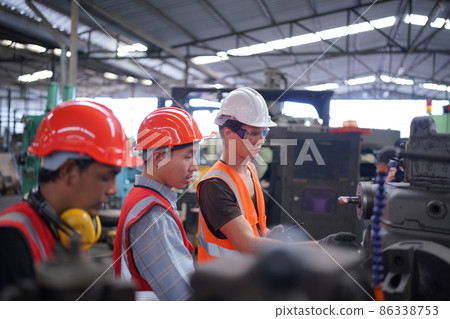 Industry engineer worker operate control heavy machine in factory. Industry engineer worker operate control heavy machine in factory. 86338753