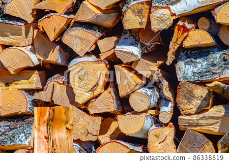 woodpile of chopped firewood with birch bark woodpile of chopped firewood with birch bark 86338819