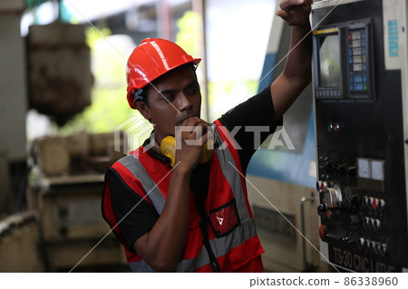 Industry engineer worker operate control heavy machine in factory. Industry engineer worker operate control heavy machine in factory. 86338960