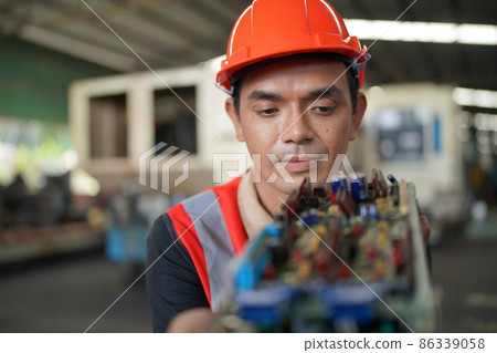 Industry engineer worker operate control heavy machine in factory. Industry engineer worker operate control heavy machine in factory. 86339058