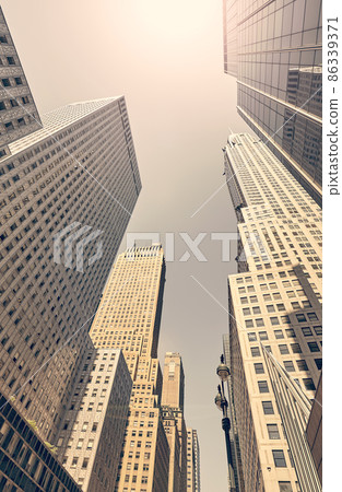 Retro toned picture of Manhattan skyscrapers, New York City, USA. Retro toned picture of Manhattan skyscrapers, New York City, USA. 86339371