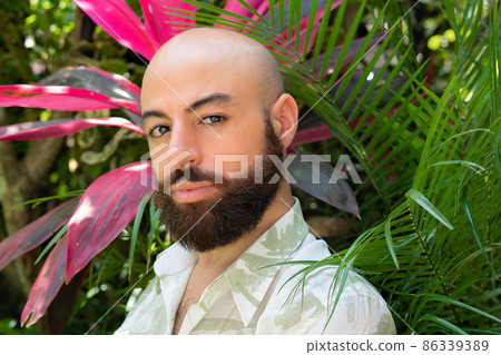 bearded man in a green shirt portrait 86339389