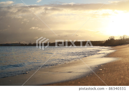 Dawn on the Baltic Sea sand water waves. Sea in Gdansk, Poland 86340331