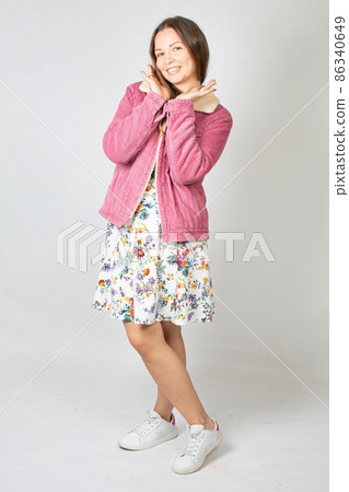 Young woman in spring colours in studio Young woman in spring colours in studio 86340649