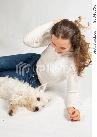 Young woman in warm jumper on white 86340750
