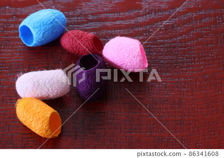 Mayu ball on a lacquered board 86341608