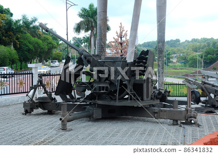 PORT DICKSON, MALAYSIA -MAY 08, 2016: Old war cannon restored and display for public at Malaysia Army Museum or Muzium Tentera Darat in Port Dickson, Negeri Sembilan, Malaysia. PORT DICKSON, MALAYSIA -MAY 08, 2016: Old war cannon restored and display for public at Malaysia Army Museum or Muzium Tentera Darat in Port Dickson, Negeri Sembilan, Malaysia. 86341832