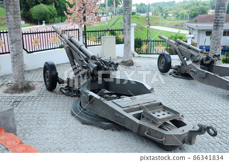 PORT DICKSON, MALAYSIA -MAY 08, 2016: Old war cannon restored and display for public at Malaysia Army Museum or Muzium Tentera Darat in Port Dickson, Negeri Sembilan, Malaysia. PORT DICKSON, MALAYSIA -MAY 08, 2016: Old war cannon restored and display for public at Malaysia Army Museum or Muzium Tentera Darat in Port Dickson, Negeri Sembilan, Malaysia. 86341834