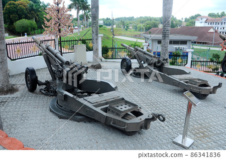 PORT DICKSON, MALAYSIA -MAY 08, 2016: Old war cannon restored and display for public at Malaysia Army Museum or Muzium Tentera Darat in Port Dickson, Negeri Sembilan, Malaysia. PORT DICKSON, MALAYSIA -MAY 08, 2016: Old war cannon restored and display for public at Malaysia Army Museum or Muzium Tentera Darat in Port Dickson, Negeri Sembilan, Malaysia. 86341836