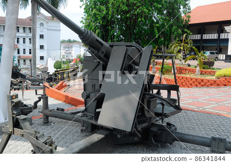 PORT DICKSON, MALAYSIA -MAY 08, 2016: Old war cannon restored and display for public at Malaysia Army Museum or Muzium Tentera Darat in Port Dickson, Negeri Sembilan, Malaysia. PORT DICKSON, MALAYSIA -MAY 08, 2016: Old war cannon restored and display for public at Malaysia Army Museum or Muzium Tentera Darat in Port Dickson, Negeri Sembilan, Malaysia. 86341844