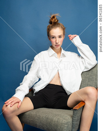 Woman with red hair on blue Woman with red hair on blue 86341885