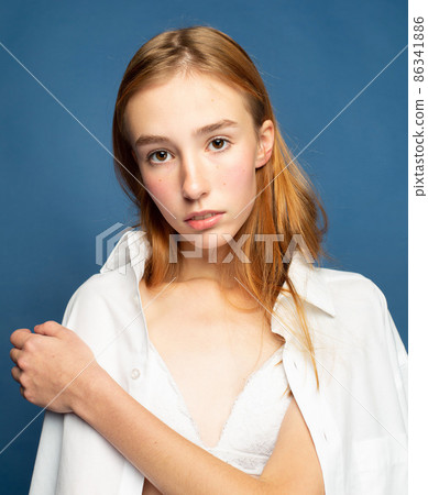 Woman with red hair on blue Woman with red hair on blue 86341886