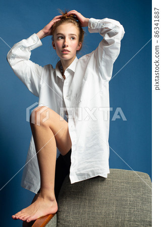 Woman with red hair on blue Woman with red hair on blue 86341887