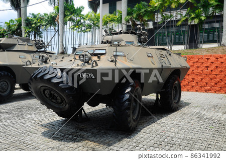 PORT DICKSON, MALAYSIA -MAY 08, 2016: Old army armor vehicle and tanks restored and display for public at Malaysia Army Museum or Muzium Tentera Darat in Port Dickson, Negeri Sembilan, Malaysia. PORT DICKSON, MALAYSIA -MAY 08, 2016: Old army armor vehicle and tanks restored and display for public at Malaysia Army Museum or Muzium Tentera Darat in Port Dickson, Negeri Sembilan, Malaysia. 86341992
